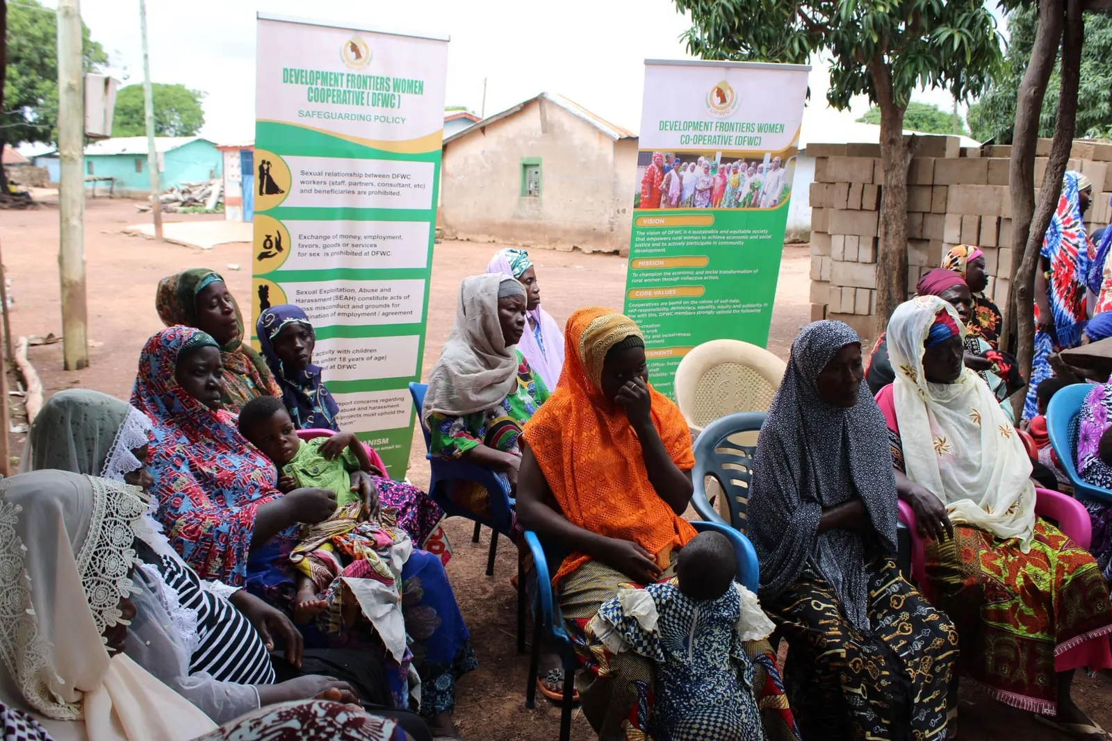 Women listening during a DFWC community meeting